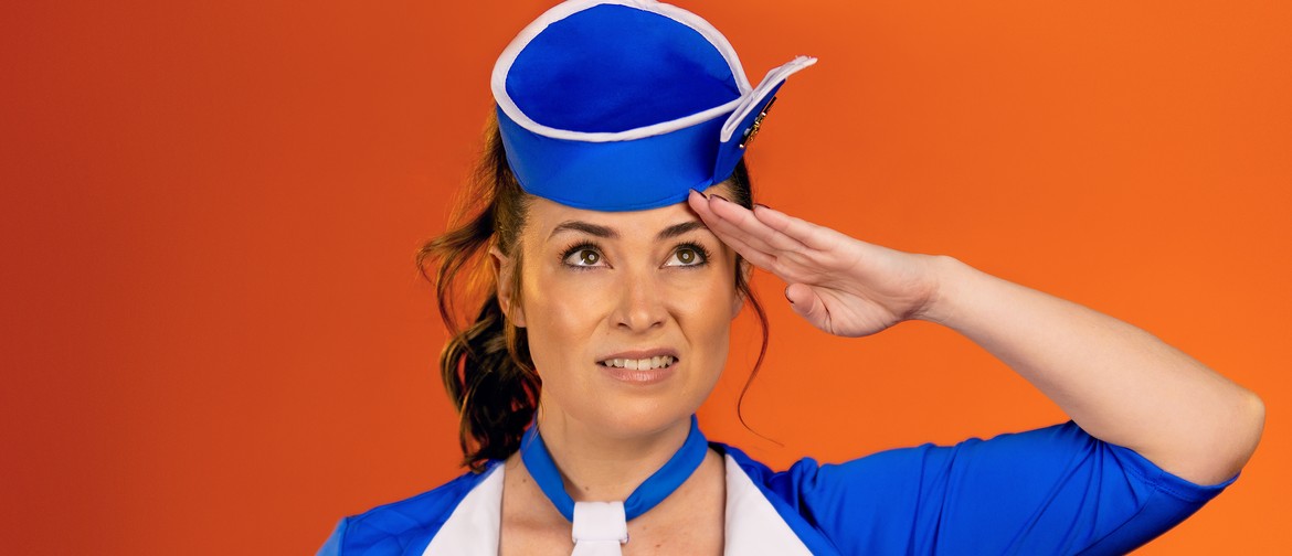 A woman with brown hair is dressed in a blue air hostess uniform. She is saluting but looks a bit awkward.