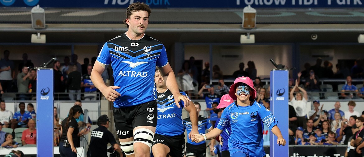 Western Force vs Hurricanes Force skipper Jeremy Williams runs on to HBF Park with a young rugby fan