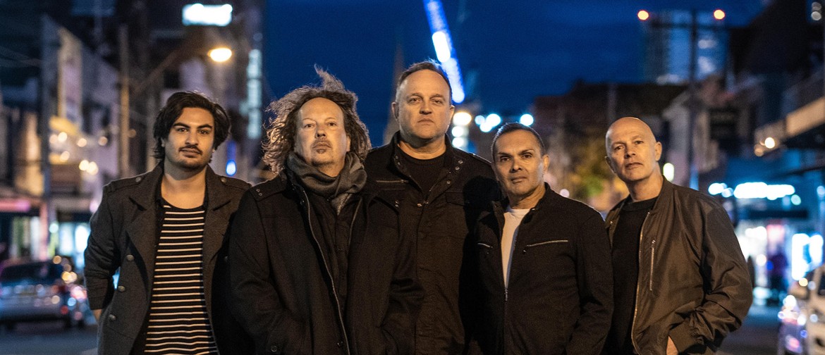 Five Taxiride band members standing in a line