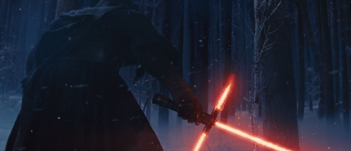Star Wars: The Force Awakens in Concert A jedi in a black hooded cape wields a red light saber