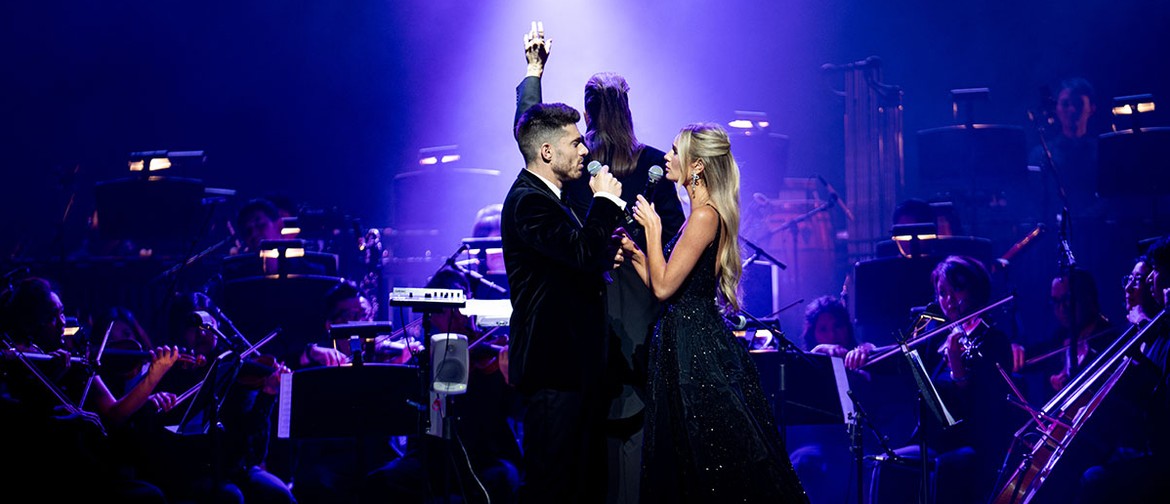 An Evening on Broadway Amy Manford and Josh Piterman stand facing each other, singing, in front of of the MSO