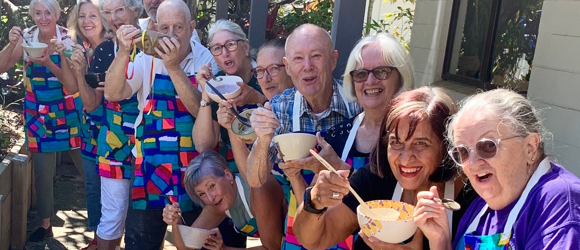 Club memebers enjoying their soup in bowls