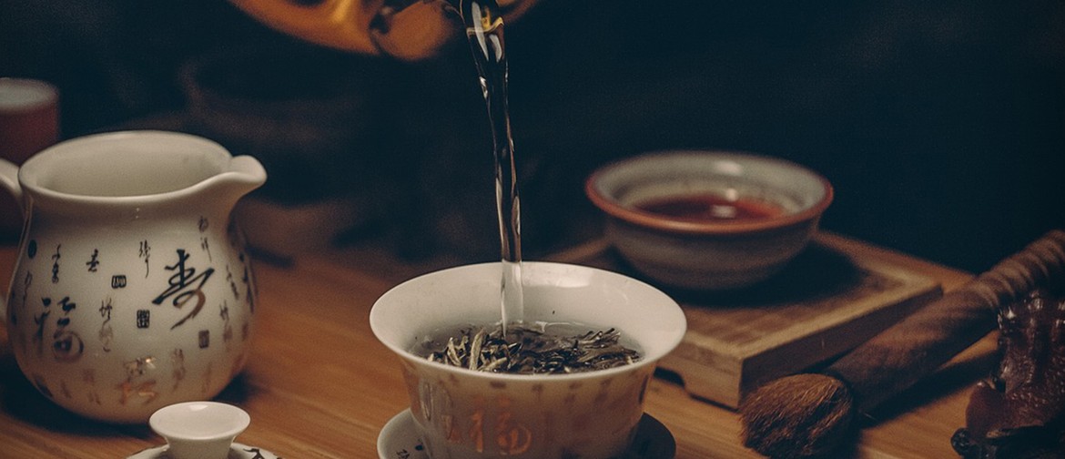 Terracotta Warriors: Art Tea Photograph of a cup of tea being poured using Chinese teawares.